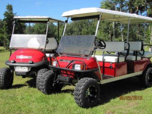 Pam Perry and Susie Suarez show off their golf carts just after getting new paint, lift kits, wheels and tires.  Oh, and Dale and Kevin contributed a little bit of elbow grease to get them done. 